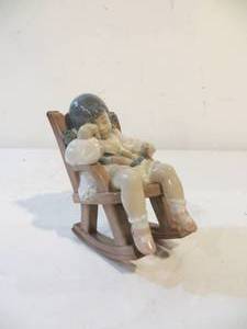 lot 30 image: Lladro Child in Rocker with Doll (Naptime) Figurine