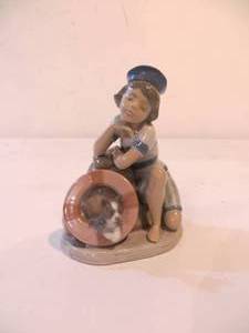 lot 35 image: Lladro Boy with Dog (Mondays Child) Figurine
