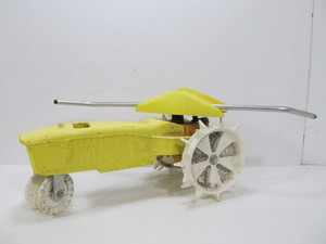 lot 214 image: Yellow Metal NELSON Cast Iron Walking Tractor Sprinkler