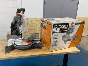 lot 71 image: Ridgid 15 Amp 10 in. Dual Miter Saw with LED Cut Line Indicator