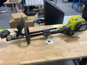 lot 58 image: RYOBI 4-Cycle 30cc Attachment Capable Straight Shaft Gas Trimmer