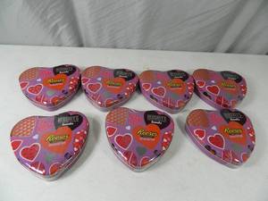 lot 104 image: 7 New Tins of Hersheys and Reeses Candy