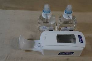 lot 112 image: Purell Dispenser with Expired Hand Sanitizer