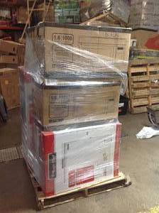 lot 15 image: Pallet of assorted appliances includes microwaves , chest freezers, and 2 door refrigerator ( customer returns )
