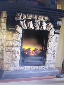 lot 84 image: Faux Stone Fireplace damaged, inser...