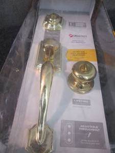 lot 268 image: Kwikset Montara Polished Brass Sing...