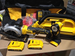lot 39 image: Dewalt Tool Combo 20-Volt MAX Lithium-Ion 12 Gal. WetDry Portable Vacuum , ATOMIC 20-Volt MAX Cordless 4-12 in. Circular Saw, and Portable Light - 2 batteries and charger in like new condition
