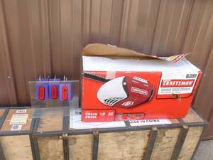 lot 6 image: Craftsman 12 hp Chain Drive Garage Door Opener. Appears new in box. As shown.