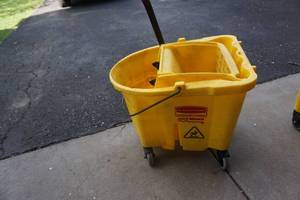 lot 52 image: Rubbermaid Brand Commercial Wave Brake Wheeled Janitors Mop Bucket