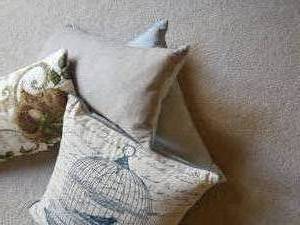 lot 74 image: Pretty Bird and Oatmeal Throw Pillows, Set of 4