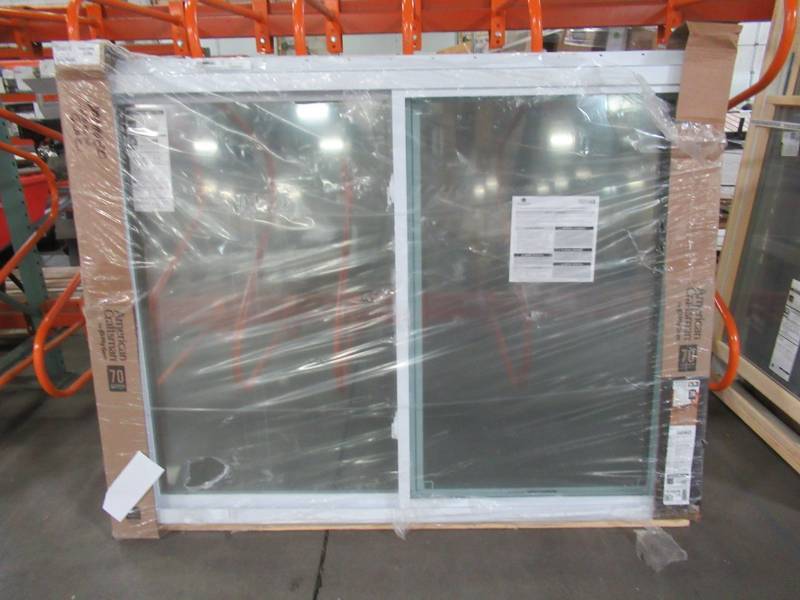 lot 602 image: American Craftsman 70 Series 5040 White Vinyl Sliding Window, Approximately 60 X 47 X 1 34 With Screen - Fixed Panel one Pane is Broken.