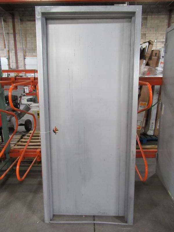 lot 605 image: Armor Door Approximately 36 x 82 x 6 (32 x 79 Slab) Fire-Rated Gray RH Swing Flush Unfinished Steel Commercial Door Slab with Knock Down Frame and Hardware.