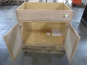lot 212 image: Hampton Bay Assembled 36x34.5x24 in. Sink Base Kitchen Cabinet in Unfinished Beech KSB36-UFDF