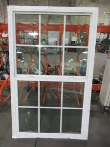 lot 601 image: Pella Single Hung Window in White Vinyl, 12 Screen, Internal Grills, Bottom Tilt. - Small Hole in Screen