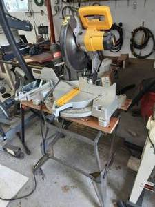 lot 73 image: Dewalt 12 Miter Box Mounted On Stand