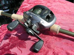 lot 24 image: Daiwa Baitcaster Fishing Reel on Gander Mountain Vortex Rod