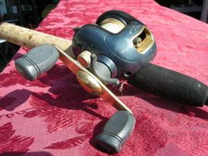 lot 25 image: Pinnacle Baitcaster Fishing Reel on Abu Garcia Royal X Graphite Rod
