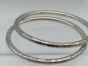lot 102 image: Pair of Sterling Silver Bangle Bracelets