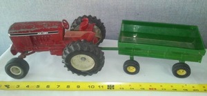lot 69 image: Agri Power tractor pulling John Deere dump wagon.