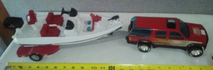 lot 91 image: Tonka Truck. Boat & trailer.