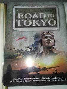lot 108 image: World War 2 scrapbook & DVDs.