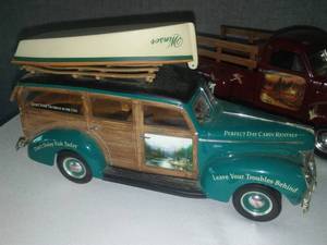 lot 132 image: 4 Rare Terry Redlin ERTL trucks, ERTL collectibles with shelf.