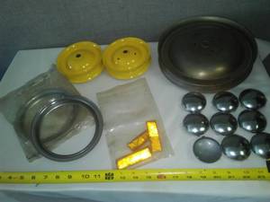 lot 175 image: Parts -Pulleys, 2in.  hubcaps, reflectors, trim Rings.