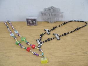 lot 32 image: Harley Davidson Metal Sign -Necklaces