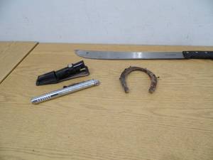 lot 34 image: Spring Loaded Baton - Machette