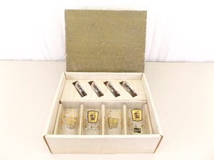 lot 15 image: NEW Mid Century Galaxy 22k Gold Guilded Highball 4 Glass and Coaster Set