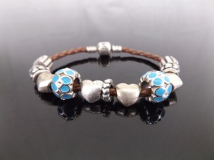 lot 57 image: .925 Sterling Silver PANDORA Brown Leather Heart Charm Bracelet