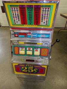 Vintage 25 Cent Slot machine lights up with keys