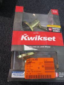 lot 195 image: Kwikset Lido Polished Brass Entry D...