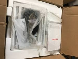 lot 23 image: Toshiba 12,000 BTU 115-Volt Smart Wi-Fi Window Air Conditioner  Open box not used