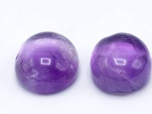 lot 38 image: Two Royal Purple Amethyst Cabochons