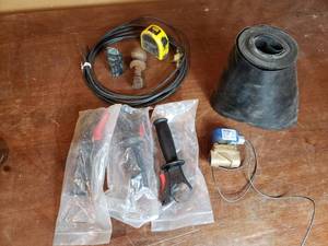 lot 100 image: Milwaukee Tool Handles, Roll of Vinyl, 1 78 Ball, Alcon Valve