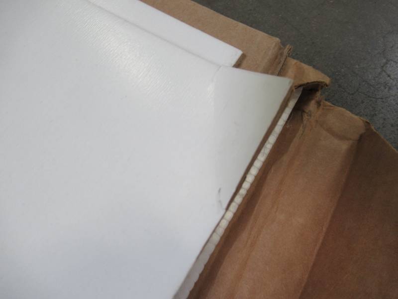 lot 600 image: 2 Sheets of White Laminate Panels Approximately 48 X 48 - Small cracks on Corners and Edges.