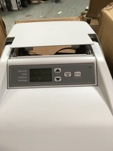 GE 30,000 Grain Water Softener not used what small damage on the cover please review the pictures