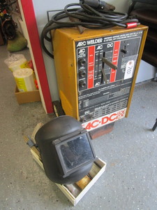 lot 702 image: ARC WELDER WITH HELMET AND RODS
