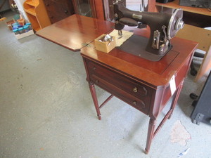 lot 819 image: DOMESTIC ELECTRIC SEWIG MACHINE WITH CABINET