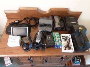 lot 279 image: Polaroid Camera, Canon Movie Camera, Minolta Camera, Garmin GPS Device