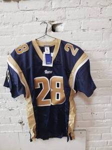 lot 75 image: LA Rams Game Jersey  Marshall Faulk  #28 Size 52