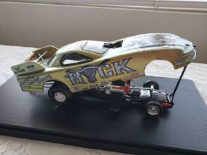 lot 116 image: JERRY TOLLIVER 124 Die Cast WWF The Rock Funny Car