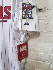 lot 55 image: Twins Away Game Jersey  Metrodome Celebration Size 60