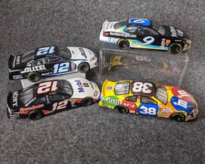 lot 28 image: Lot of 4 Die Cast NASCAR Collectible Cars