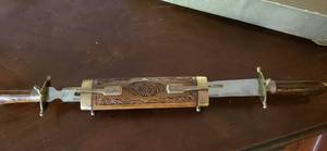 lot 69 image: Ornately Carved Wood Double Sided Knife And Fork