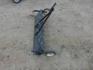 lot 4 image: Pull Type Lawn Thatcher