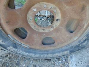 lot 21 image: Truck Tire and 8 Bolt Rim
