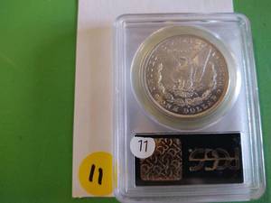 lot 11 image: 1884-O Morgan Dollar PCGS MS 65