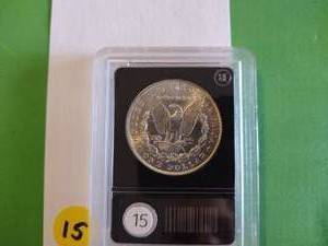 lot 15 image: 1888 BU Morgan Dollar in a Holder